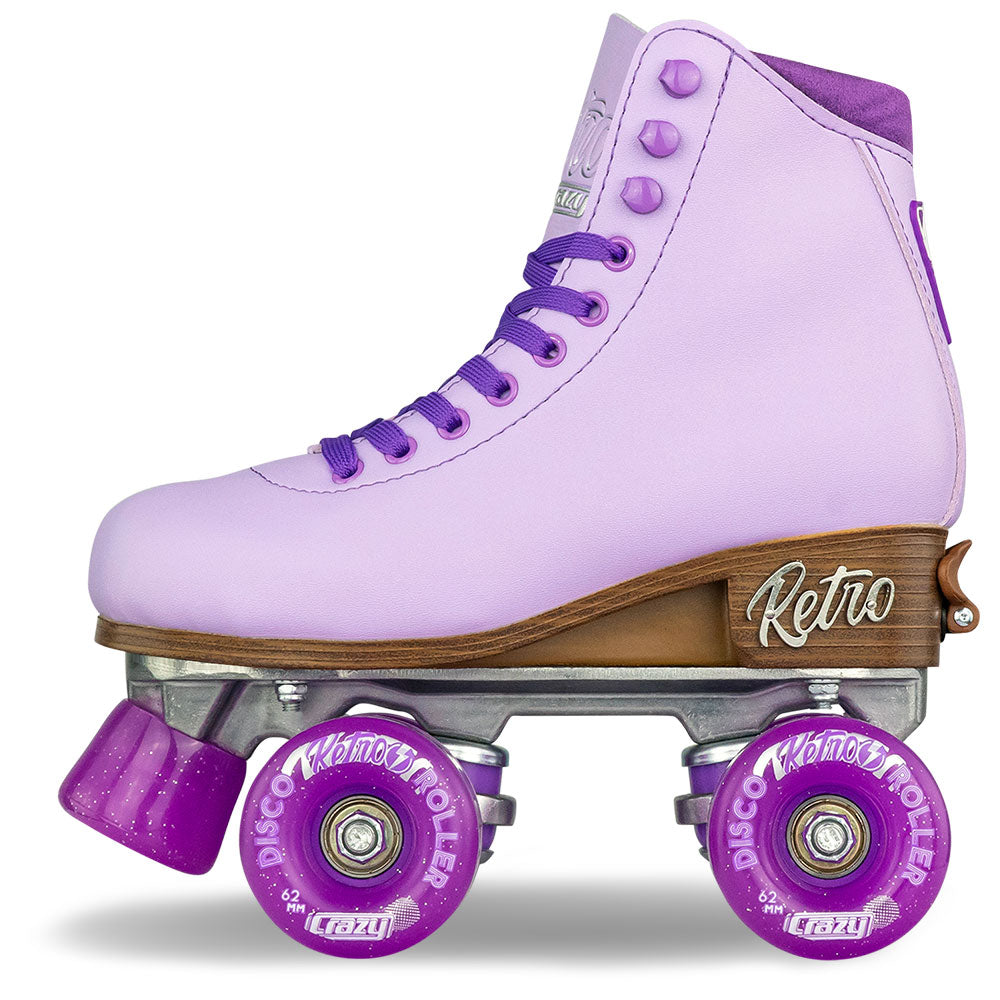Purple retro roller skates with wooden deck and purple wheels on a white background